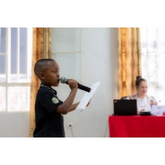 UNICEF/UN0337383/Rudakubana
10-year-old Manzi takes part in an event in Rwanda where children showcase their lives and stories.