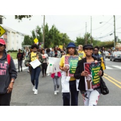 Protesters march down Martin Luther King Jr. Avenue SE during the 2017 Grocery Walk to demand greater investment in food access programs and healthy food retail options. (Credit: Brian Oh/Courtesy of DC Greens. See complete caption below)