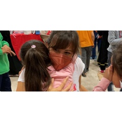 Save the Children Trustee and actress Jennifer Garner receives a hug from a girl in a childrens play and activity space (See complete caption below).
