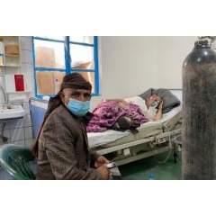 A patient rests inside the COVID-19 treatment center in al-Kuwait hospital. Throughout the pandemic, a lack of access to essential medical supplies (see complete caption below).