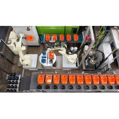 The 6-axis robot places the vacuum cleaner and motor pot housing for the dispensing application in one step on the rotary indexing table part fixtures.