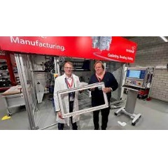 Harald Dekkers, Dometic Product Area Manager for Windows, Blinds, Doors & Sanitary and Peter Fischer, Henkel Senior Manager Market & Customer Activation, present a Dometic window frame sealed with PU foam, (see complete caption below)
