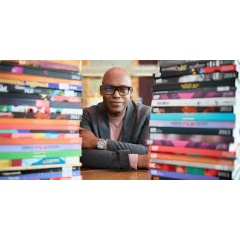Cameron Bailey with TIFF Programming Books. Photo credit: Margaret Lee