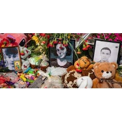 © UNOCHA/Viktoriia Andriievska Toys, flowers, and candles are laid to honour people killed during an airstrike on Kyiv. (file)