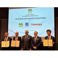 The signatories hold the signed MoU: Zulkifli bin Romli, General Manager of MADA; Adrian Marcellus, CEO of MyDIGITAL Corporation; and Naoki Yamaguchi, General Manager of ICT Solutions Division, Toshiba Digital Solutions Corporation (left to right)