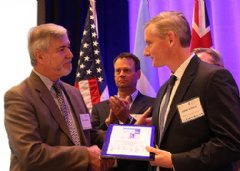 Accepting the award was Jim McHale, Ph.D., American Standard vice president of research, development and engineering, pictured on the right.