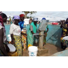 Refugees from Nigeria queue to get water at the Minawao camp in Cameroon. UNHCR has registered over 40,000 Nigerian refugees in Cameroon’s Far North region to date, and 32,000 of them have moved to Minawao. Photo: UNHCR/D. Mbaiorem