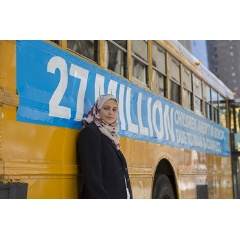UNICEF Goodwill Ambassador Muzoon Almellehan stands for a portrait near a bus in the convoy of 27 empty school buses travels through the streets of Manhattan to shine a spotlight on 27 million out-of-school children living in conflic