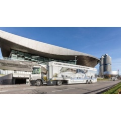 An electric truck transporting vehicles to BMW Welt Munich