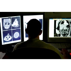 A radiologist reviews CT scans from a patient with a brain injury. (U.S. Air Force photo/Senior Airman Julianne Showalter)