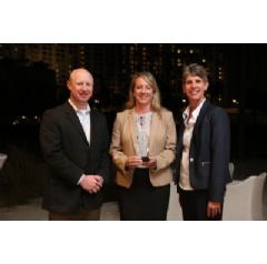 “Eganne Wolfington of Wolfington Body Company, Inc. accepts the 2017 Dealer of the Year award. She is flanked from Left to Right, by Ryan Kauffman (VP Sales, IC Bus) and Trish Reed (GM & VP, IC Bus).