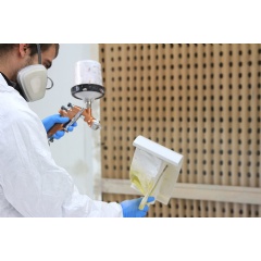 A 3D-printed spacer panel receives a paint job before being installed aboard an Airbus A320 aircraft operated by Finnair – the first use of a 3D-printed component that can be seen by passengers