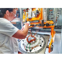 Series production of electric motors officially started in Győr. The electric motors are produced on floor space of 8,500 square meters with an innovative production concept: modular assembly. In the picture: Tubing the various coil windings
