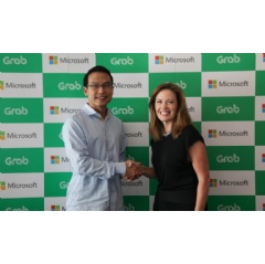 Ming Maa, president of Grab (left), with Peggy Johnson, Executive Vice President of Business Development, Microsoft.