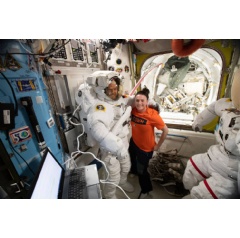 NASA astronaut Serena Aun-Chancellor assists ESA (European Space Agency) astronaut Alexander Gerst with a spacesuit fit-check in preparation for spacewalks. Credits: NASA