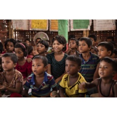 © UNICEF/UN0326961/Brown
Children recite a lesson at a UNICEF-backed learning space in the Kutapalong Rohingya refugee mega camp in Cox’s Bazar, Bangladesh.