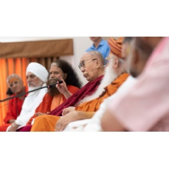 His Holiness the Dalai Lama speaking to members of the ashram in the auditorium at Sri Udasin Karshni Ashram in Mathura, UP, India. Photo by Tenzin Choejor