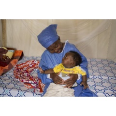  UNICEF DRC/Nybo
Madelaine, a carer at a UNICEF-supported nursery in Beni, the Democratic Republic of the Congo, holds five-month-old Guerrishon.
