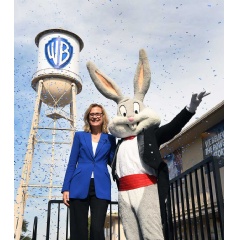 Warner Bros. Chair and CEO Ann Sarnoff and Bugs Bunny unveiling the company’s refreshed logo on the Studio’s iconic water tower.