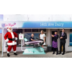 Santa Claus with Jack Bowtell, mum Anna Bowtell and Air New Zealand cabin crew Tonica Cassie-Alatini and Grant Heta on location outside the 14th Ave Dairy in Tauranga
