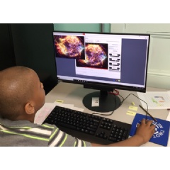 A YouthAstroNet participant uses his newly acquired image analysis skills to create a composite image of an exploded star using real data from Chandra X-ray Observatory. Credit: Mary Dussault/Center for Astrophysics | Harvard & Smithsonian