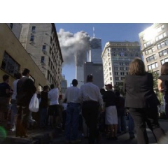 Pedestrians in lower Manhattan watch smoke rise from the World Trade Tower, Sept. 11, 2001, after an early morning terrorist attack on the New York landmark. (AP Photo/Amy Sancetta)