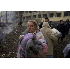 Mariana Vishegirskaya stands outside a maternity hospital that was damaged by shelling in Mariupol, Ukraine. Vishegirskaya survived the shelling and later gave birth to a girl in another hospital in Mariupol. (AP Photo/Mstysl