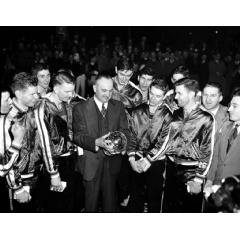 University of Kentucky basketball coach Adolph Rupp and his team admire the NCAA basketball title cup after defeating Oklahoma A&M 46-36 in Seattle in March 1949, which was the first year of the AP men’s basketball poll.
(AP Photo/Paul Wagner)