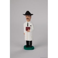 Venezuelan folk sculpture of José Gregorio Hernández, a late 19th- and early 20th-century physician who became a symbol of health-care charity.