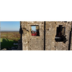 A visitor looks out of the Kings view window from a scaffolding platform at Corfe Castle, Dorset |  National Trust - Richard Gregory