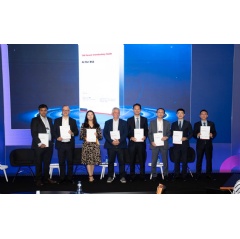 A photo from the event at which TM Forum and Huawei jointly released the two reports at DTW 2025