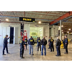 Owner and President Patrick Connell shows off the new paint shop to the Delaware Truck Refinishers team.