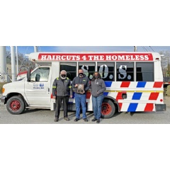 ARS employees, Dominic and Steve pose in front of Salvation of Sorrows’ mobile barbershop bus with founder, Abby Anderson. Abby presented the ARS team with a plaque for their support and contribution to her organization.