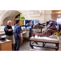 Researchers demonstrate their scanning technique, with a user holding a monopod-mounted Kinect at close range from a T. Rex skull.