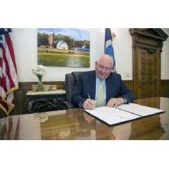 Agriculture Secretary Sonny Perdue signing a proclamation.