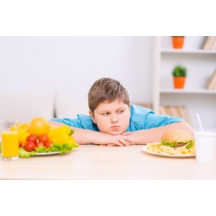 A new study shows that teen at risk for adult obesity have less active self-regulation system in the brain. Credit: iStock