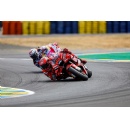 Miller climbs on the second step of the French GP rostrum at Le Mans. Bagnaia retires as he crashes out from second.