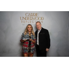Photo: SoundExchange President & CEO Michael Huppe presents Carrie Underwood with a SoundExchange Hall of Fame Award at Resorts World Theatre in Las Vegas. (Photo credit: Courtesy of Carrie Underwood)