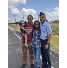 Aaron celebrates graduating basic military training with his mother and niece, May 2022